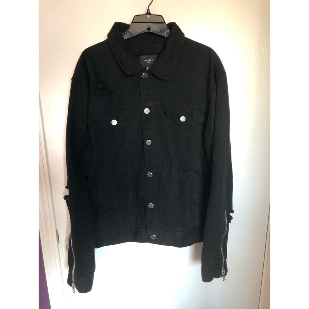 Distressed black jean jacket with zippers